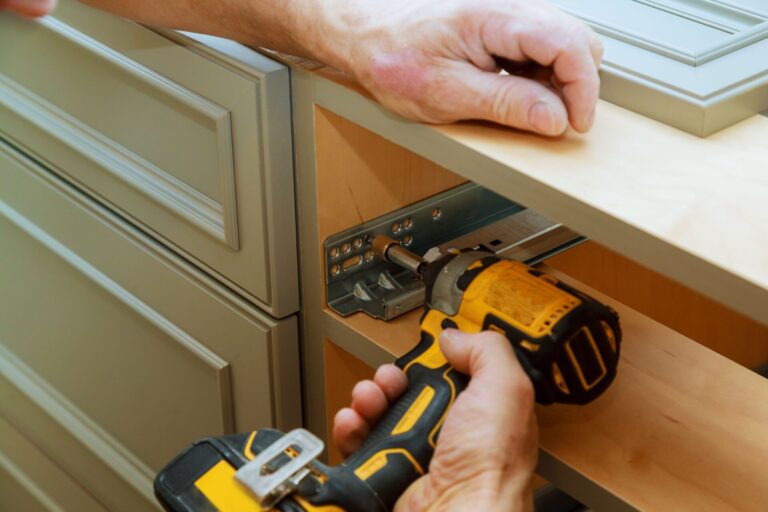 Cabinet installers attaching kitchen cabinet hardware in Morris County NJ kitchens.